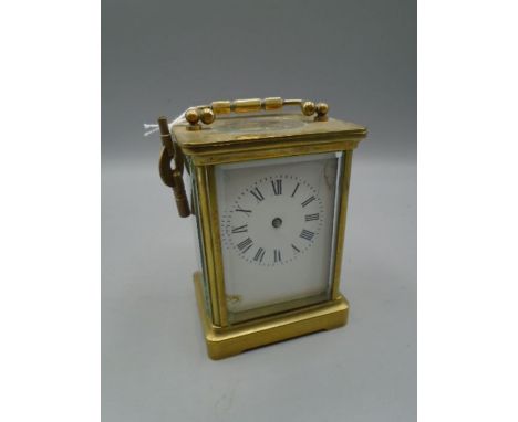 A 5 glass carriage clock 4 1/4" high not inc handle, with key. hands loose in case