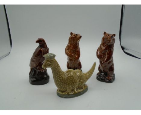 2 Beswick Beneagles scotch whiskey decanters of the Loch Ness Monster and an eagle plus 2 Wade Beneagles bear decanters, all 