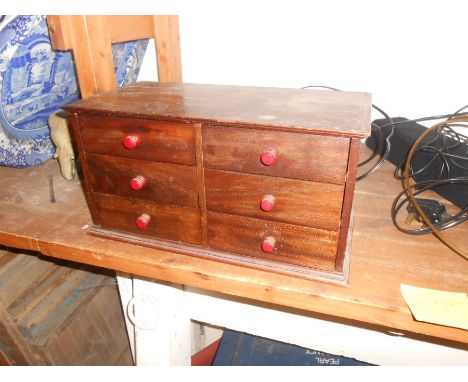 mini six drawer chest includes contents of fine engineering tools including a miniature anvil. Chest of drawers 40cm w x 21cm