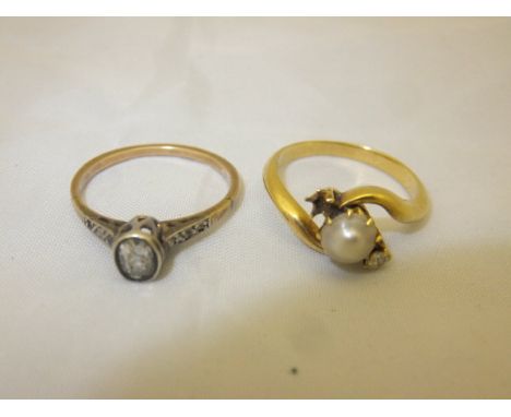 A single stone diamond ring, together with a pearl and diamond mounted yellow metal ring (one stone missing)