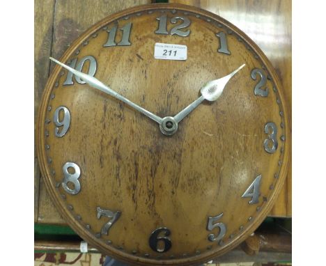 An Arts and Crafts mahogany convex wall dial with chrome plated Arabic numerals, the Swiss movement by Zenith, 18 days, seria