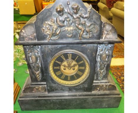 A Victorian black slate cased and brass embellished mantel clock of large proportions, the eight day movement with Roman nume