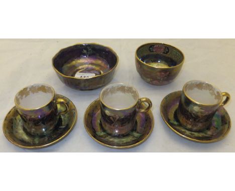 A mid to late 1920's Maling bowl with blue lustre ground decorated with Eastern birds pattern, a set of three 1930's Maling c