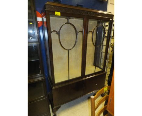 A mahogany astragal glazed three shelf display cabinet with two doors with blind fretwork carving to top on cabriole legs to 