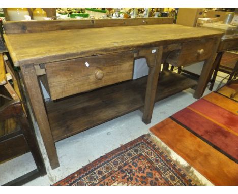 A 19th Century pine kitchen work bench/work unit, the rectangular top with two suspended drawers with turned knob handles, ab