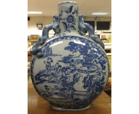 A large 20th Century Chinese blue and white crackleware decorated moon flask with dragon handles, bears seal mark to base