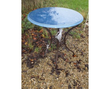 A blue ceramic topped garden table on iron base