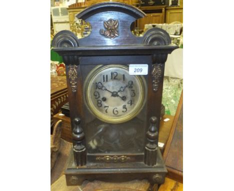 A late 19th Century walnut cased eight day mantel clock