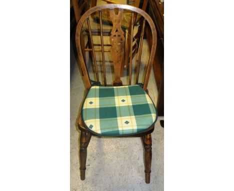 A modern pine refectory table, and a set of four beech and elm wheel and stick back chairs