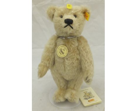 A Steiff 1920 Classic reproduction gold plush teddy bear, a Steiff Teddybear 24 circa 2001, a box of various modern dolls, so