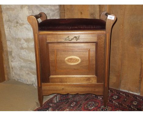 An Edwardian mahogany and inlaid piano stool with fall front music compartment