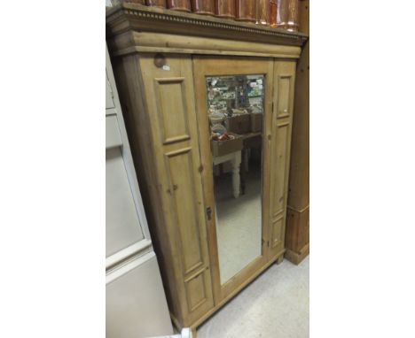 A pine single mirrored door wardrobe of small proportions, together with a white painted towel airer, and a white painted thr