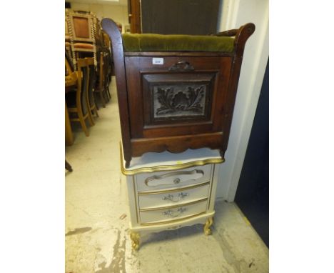 An Edwardian walnut piano stool with green plush upholstery top, and a modern gilt and white painted three door bedside table