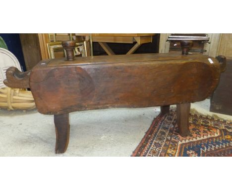 An Indonesian lidded rice mortar carved from a solid trunk, upon four simple legs CONDITION REPORTS Approx 156 cm wide includ