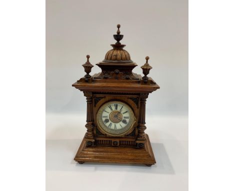 A 19th Century “Westminster” mantel clock having German Wurtemberg movement hour and half hour striking on a gong in architec