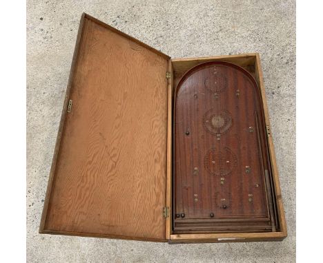 An early 20th Century wooden bagatelle board with metal balls and original wood striker, contained in pine storage box. Viewi