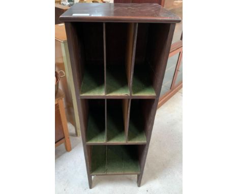 A 20th century mahogany unit of pigeon holes, the top two sections with two dividers, the bottom section lacking dividers, 13