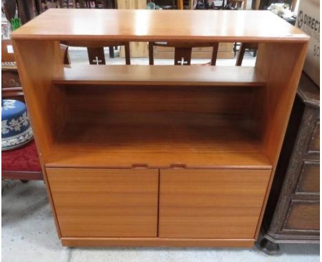 A mid-20th century unit, the top half with open back and third width fixed shelf, the base with two door cupboard section ope