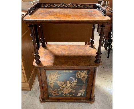 An unusual 19th century walnut veneer music cabinet, the top with decorative cut out carved gallery and inlaid decoration, on