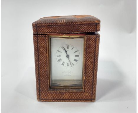 A French made brass cased carriage timepiece in travelling case with sliding glass panel and key, the white enamel dial inscr