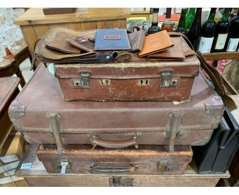 Two vintage leather suitcases, another, a black briefcase, a brown leather satchel and various wallets to include a dark brow