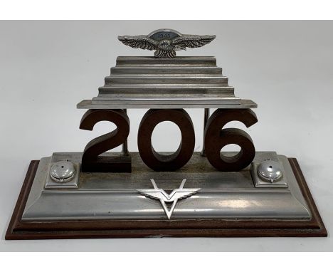 A presentation desk stand to Air Commodore F E Vernon constructed from 206 Group number plate set with two small inkwells eit
