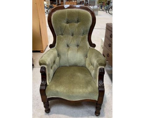 A Victorian balloon back upholstered chair with button back, moulded detail to the front and on turned supports. Viewing/coll