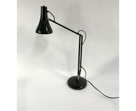 A vintage dark green painted Anglepoise style lamp, of usual form, fully extended upright with shade facing down approximatel
