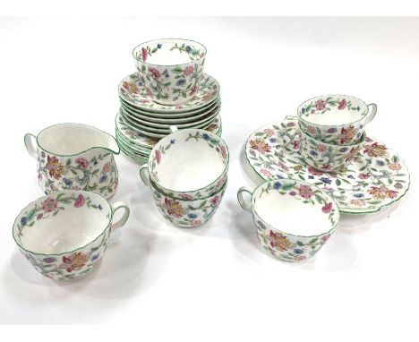 A Minton Haddon Hall pattern part tea service to include a cake plate, sugar bowl, milk jug, six side plates, six tea cups an