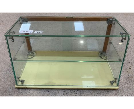 A circa1960’s Seal counter top display cabinet with sliding glass doors to the back and single glass shelf, 33cms high, 60.5c