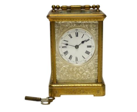 An engraved brass carriage clock by Richard & Cie, serial number 648, with key, 14cm. Condition - fair, dial cracked. Not tes