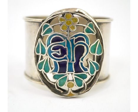 An Arts and Crafts silver and enamel napkin ring, maker’s mark LH, Birmingham 1938, 4.5cm high. Condition - fair