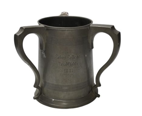 A 19th century pewter three handled rowing trophy from Caius College, 19cm. Condition - fair