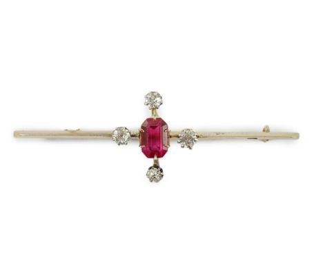 An early to mid 20th century gold, single stone oval cut synthetic ruby and four stone round cut diamond set bar brooch, 57mm