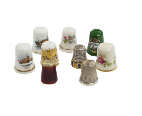 A large collection of silver, nickel, brass and ceramic thimbles, and two thimble display perspex domes. Condition - fair