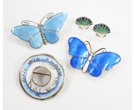 Two Scandinavian gilt white metal and enamel butterfly brooches, largest 52mm, together with a white metal and enamel circula