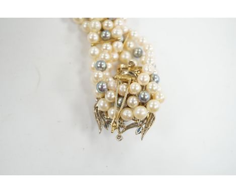 A modern triple strand two colour cultured pearl necklace, with yellow metal clasp and detachable yellow metal baroque pearl,