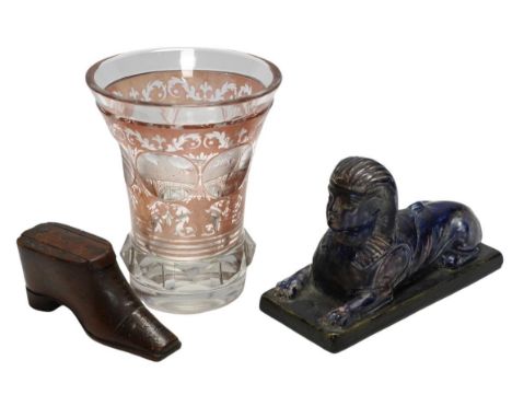 Sundry items comprising a Victorian flashed cut and engraved beaker, a 19th century model of a sphinx, and a green shoe snuff