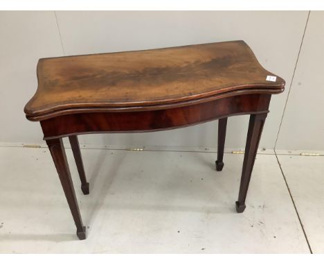 A George III banded  serpentine mahogany 'concertina action' folding card table, width 88cm, depth 44cm, height 73cm. Conditi