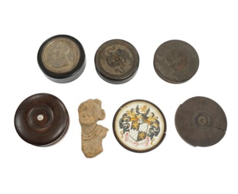 A carved wood case containing armorial crest, Tenax Justitiae, four other circular boxes and a portable compass etc, largest 
