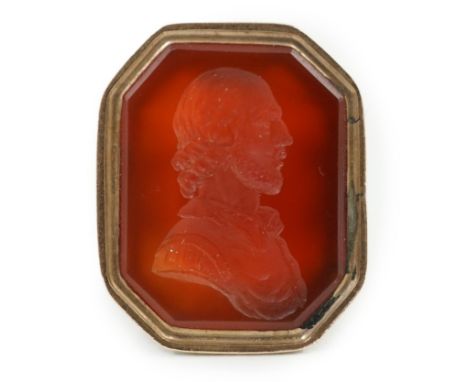 An early 19th century gold overlaid intaglio fob seal, with agate matrix engraved with a portrait bust of a 16th century gent