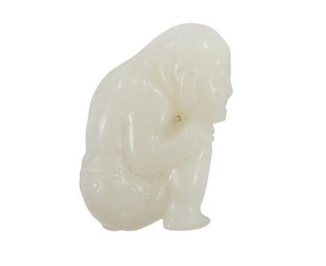A Chinese white jade carving of a crouching figure, 4.5cm high. Condition - good