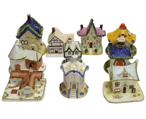 Ten various ceramic model cottages. Condition - fair to good