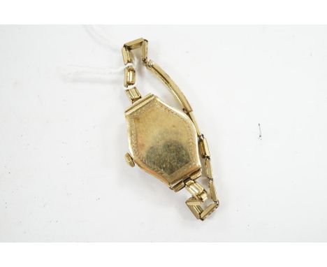 A lady's 14k manual wind wrist watch, with Arabic dial and engraved case, on a gold plated bracelet. Condition - poor
