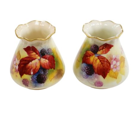 A pair of Worcester K. Blake pots, 8cm high. Condition - some gilding missing