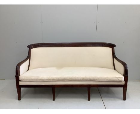 A French Empire upholstered mahogany settee, width 176cm, depth 60cm, height 92cm and a similar fauteuil. Condition - good