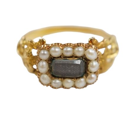 A 19th century yellow metal, seed pearl and plaited hair set mourning ring, the ring head verso inscribed 'In memory of a dea