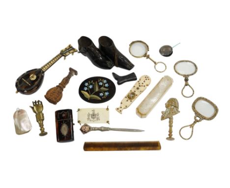 Miscellaneous objects of vertu including a pair of carved wood boots, an inlaid tortoiseshell needle case, a carved mother of