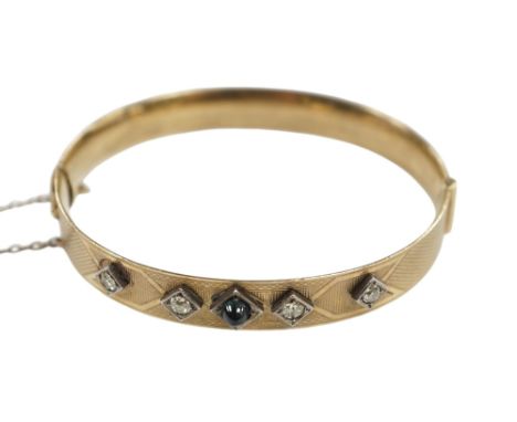 A Lagarmic diamond and green cabochon set 9ct and bronze core hinged bangle. Condition - fair