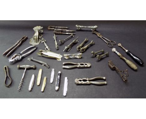 Interesting collection of metalware to include a selection of penknives, nutcrackers, knife rests, sardine tongs, snuffers, c
